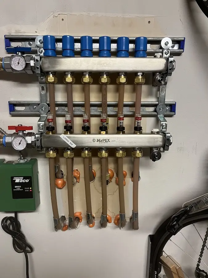 Plumber performing Water Heater Repair at a residential property in Trinity