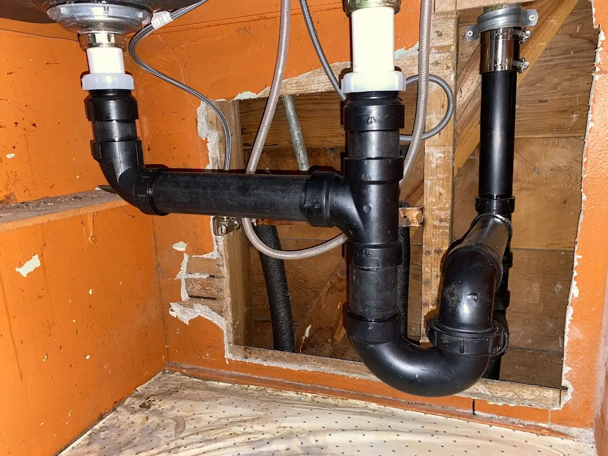 Professional Garbage Disposal Repair equipment and tools on the job in Trinity